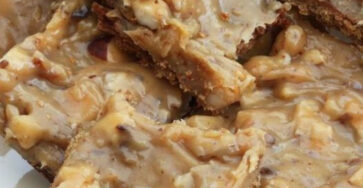 Caramel, Bisicuit And Nut Squares On A Blue Striped Plate